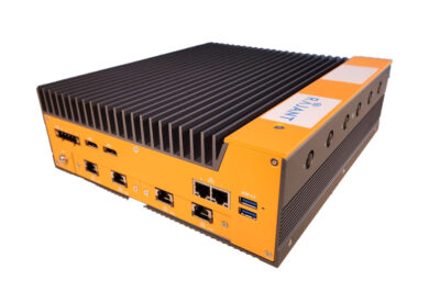 A rugged, industrial orange and black computer with multiple Ethernet ports, USB ports, and a ribbed heat sink on top, designed for heavy-duty or industrial use.
