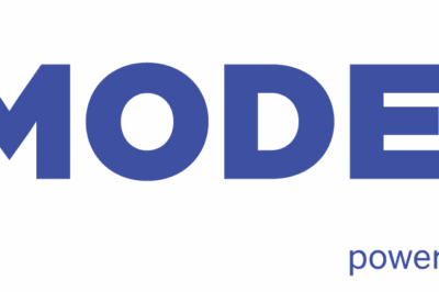 Blue "MODEX26" logo with a geometric “M” symbol on the left. Below "MODEX26," the words "powered by" and the MHI star logo appear in smaller font.