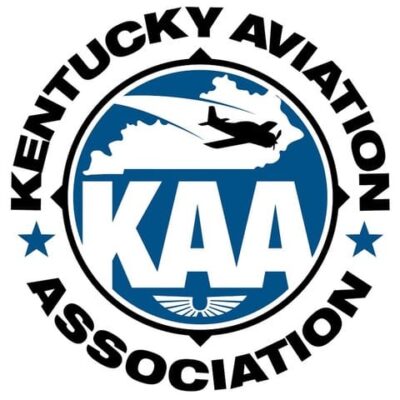 Logo of the Kentucky Aviation Association featuring a plane flying over a blue outline of Kentucky, with the large initials "KAA" and a small wing symbol, surrounded by the group's name in bold text.