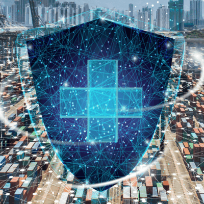 A digitally rendered shield with a glowing cross and network lines overlays a busy shipping port filled with colorful cargo containers, representing cybersecurity in global logistics.