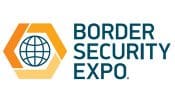 Logo for Border Security Expo featuring a globe inside a hexagon on the left and the text “BORDER SECURITY EXPO” in bold capital letters on the right. Colors are orange, yellow, and blue.