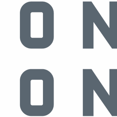 Logo with three right-facing arrows in shades of gray and orange, followed by the words "CONEXPO CON/AGG" in bold gray capital letters, with an orange slash between "CON" and "AGG.
