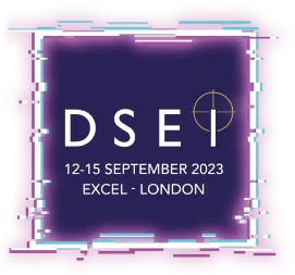 Logo with the text "DSEI 12-15 September 2023 ExCeL - London" on a dark purple square background with a digital glitchy pink and blue border. A gold crosshair symbol is featured next to the letter "I".