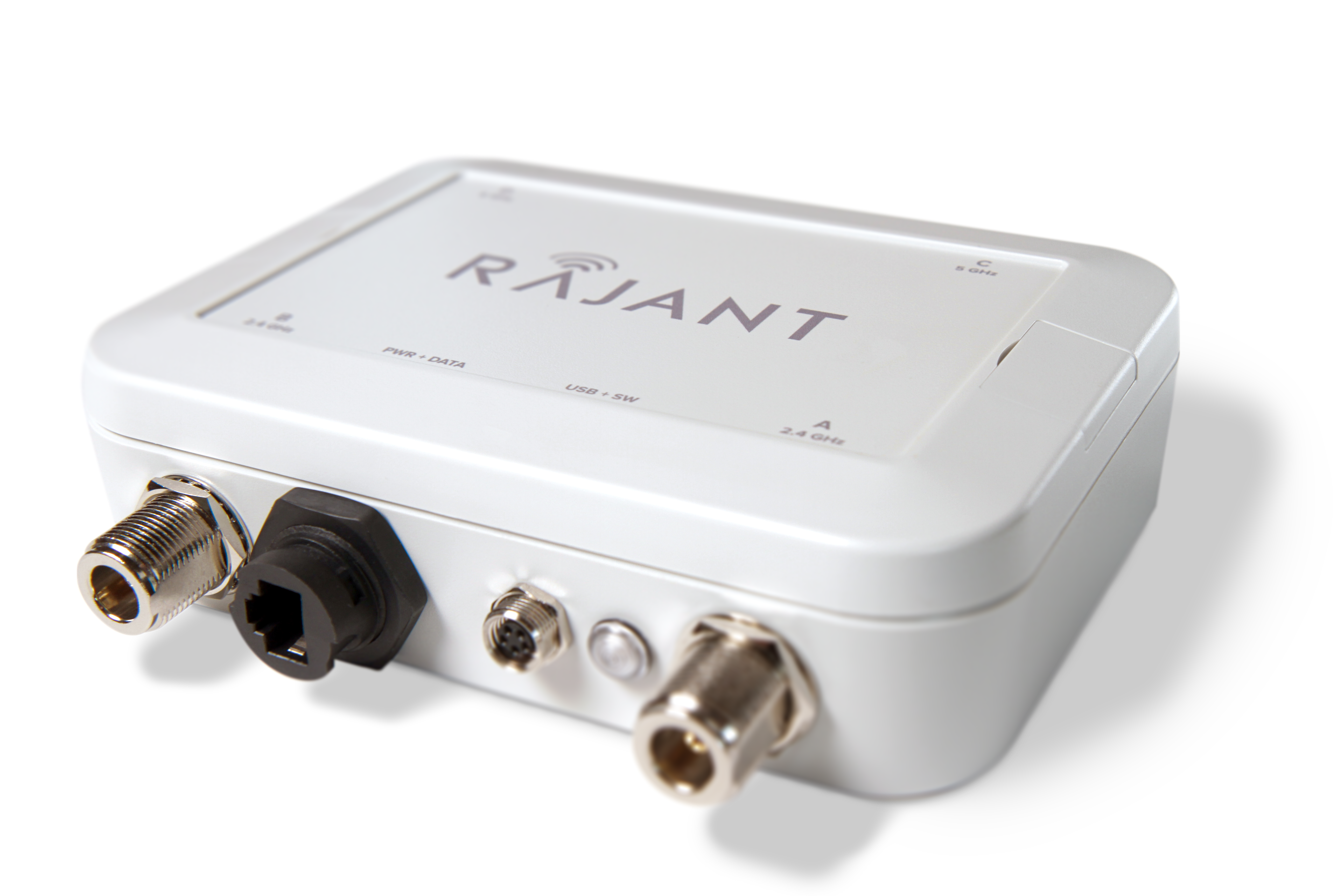 A white rectangular Rajant electronic device with multiple ports and connectors on one side, including Ethernet and coaxial ports, shown on a plain light background.