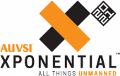 AUVSI XPONENTIAL logo featuring an orange and black "X," a small black and white QR code, and the tagline "ALL THINGS UNMANNED" with "UNMANNED" highlighted in orange.