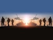 Silhouettes of soldiers, tanks, and helicopters are set against a sunset or sunrise sky, creating a dramatic military scene with light illuminating the horizon.