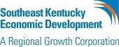 Logo for Southeast Kentucky Economic Development, a regional growth corporation. The image includes blue and brown arc shapes in the top right corner above the organization's name and tagline.