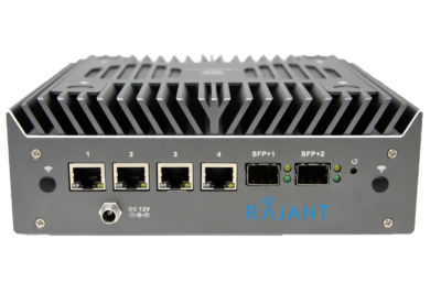 A Rajant network device with four Ethernet ports, two SFP ports, indicator lights, a DC 12V power input, and ventilation fins on top, all set against a white background.