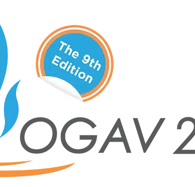 A logo with a blue and orange color scheme. A blue circle contains the text "The 9th Edition." The rest of the text is partially obscured and unreadable.