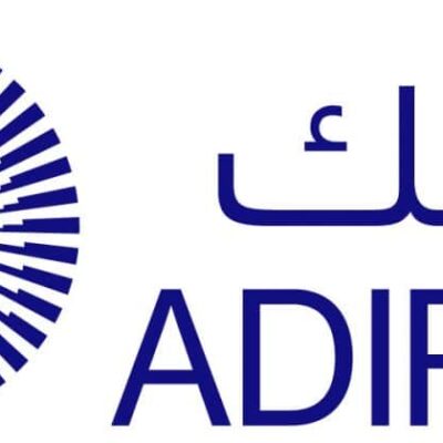 The image shows the ADIPEC logo with a circular, radiating blue pattern on the left and the word "ADIPEC" in English and Arabic text on the right.