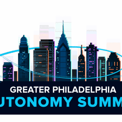 Illustration of the Philadelphia skyline with a drone, boat, and autonomous vehicle. Text reads “Greater Philadelphia Autonomy Summit,” with a blue arc connecting the transport modes above the city.