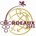 Logo with the word "Bordeaux 2015"; the "O" is formed by five circles resembling grapes. Behind the text is a globe with arrows and a satellite icon on top.