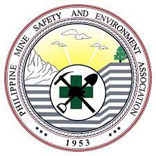 Logo of the Philippine Mine Safety and Environment Association, featuring a green cross, mining tools, a mountain, stripes symbolizing land layers, birds, a tree, and the year 1953 in a circular design.