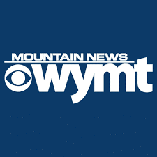 White "Mountain News WYMT" logo with the CBS eye symbol on a solid dark blue background.