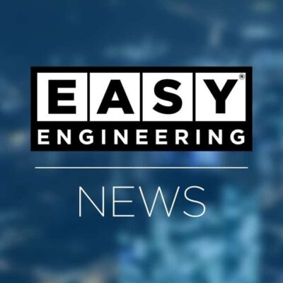 The image shows the "EASY ENGINEERING NEWS" logo, with bold white text on a black rectangular background, over a blurred blue cityscape.