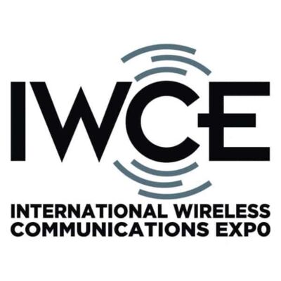 Logo for the International Wireless Communications Expo (IWCE) featuring bold black text "IWCE" with curved signal lines, and the event name written below in uppercase letters.