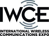 Logo for the International Wireless Communications Expo (IWCE) with bold "IWCE" letters and stylized signal waves above and below, and the full event name written underneath.