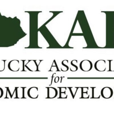 Logo for the Kentucky Association for Economic Development (KAED) with a silhouette of the state of Kentucky to the left of the acronym "KAED" in green text.