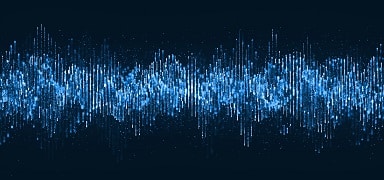 Abstract digital soundwave or data visualization image showing vertical blue lines and dots of varying height and brightness, forming a wave pattern on a dark background.