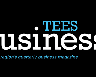 Logo for Tees Business magazine with "Tees" in blue above "Business." in large white text. Below, smaller blue text reads, "The Tees region's quarterly business magazine." Black background.