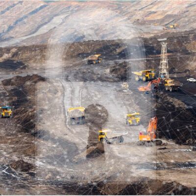A large open-pit mining operation with yellow trucks and excavators working on terraced, rocky terrain. A faint digital overlay of a human head and network lines is superimposed on the image.