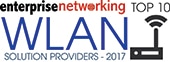 Logo with the text "enterprise networking TOP 10 WLAN SOLUTION PROVIDERS - 2017" and an icon of a Wi-Fi router with signal waves.