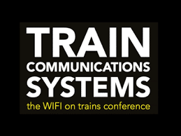 Logo with bold white text reading “TRAIN COMMUNICATIONS SYSTEMS” and smaller yellow text below that reads “the WIFI on trains conference,” all on a black background.