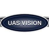 A dark blue oval logo with the text "UAS VISION" in white, centered, and bordered by a metallic silver outline.
