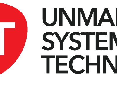 Logo for Unmanned Systems Technology (UST) with "UST" in bold white letters inside a red rounded shape, alongside black text reading "UNMANNED SYSTEMS TECHNOLOGY" on a white background.