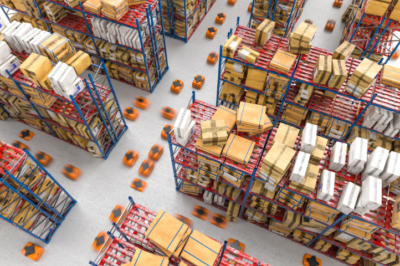 A warehouse with tall shelves filled with various boxes and packages. Numerous small orange robots move between the shelves, suggesting automated logistics and inventory management.
