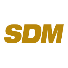 The image shows the bold, uppercase letters "SDM" in a gold color on a white background.