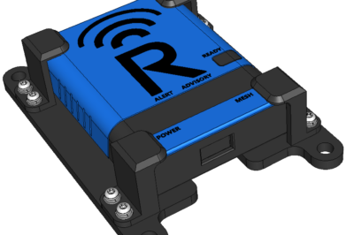 A rectangular blue and black electronic device labeled with a large "R" and symbols for alert, advisory, ready, power, and mesh, mounted on a black base with four corner screws.