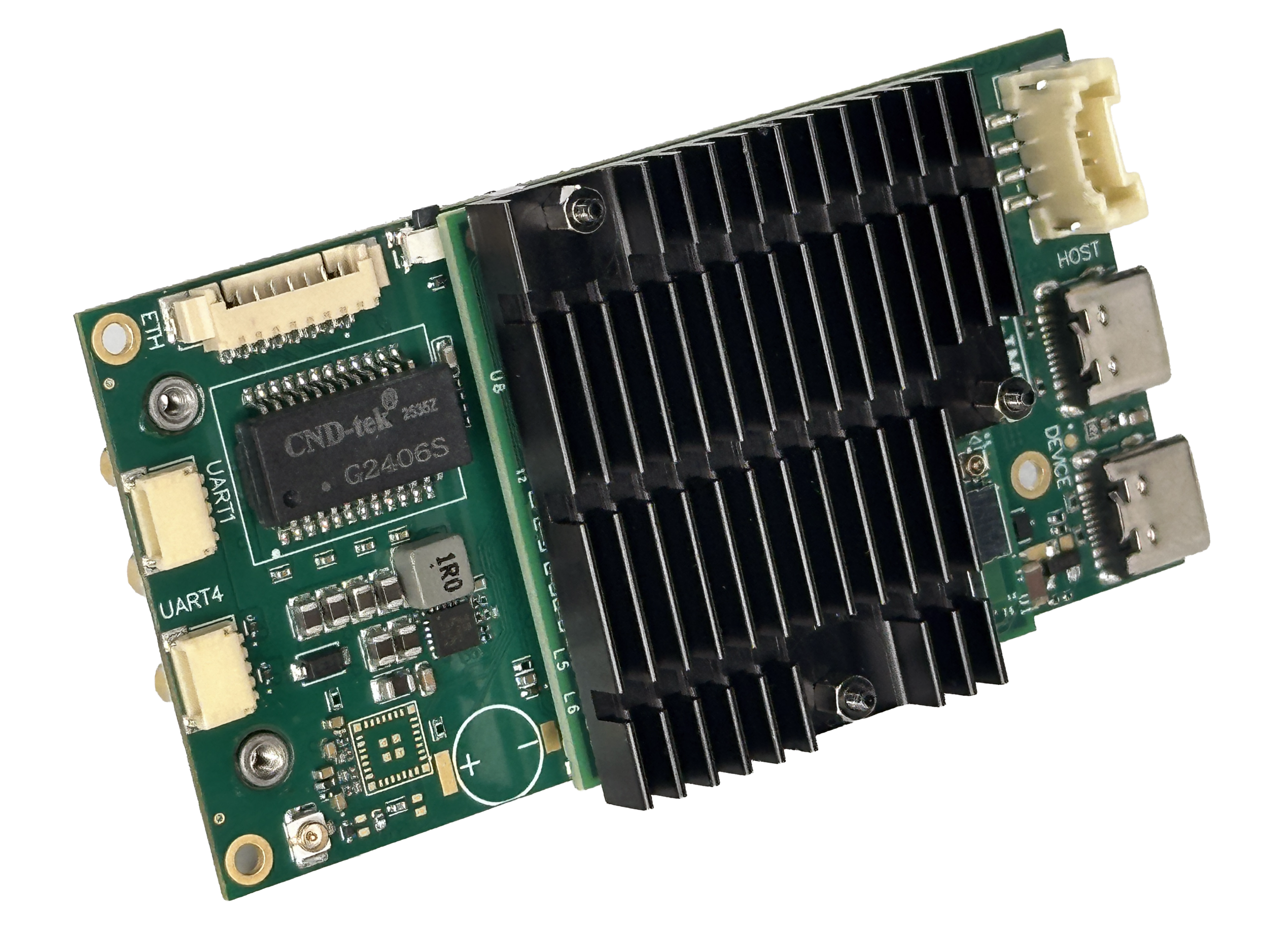 A green electronic circuit board with a large black heat sink, various ports and connectors, a visible microchip labeled “G2406S,” and several electronic components on a white background.